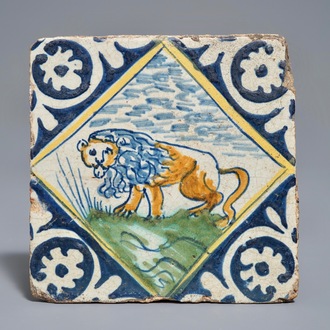 A polychrome Dutch Delft maiolica tile with a lion, 16/17th C.