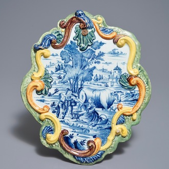 A polychrome Dutch Delft 'milk drinkers' plaque, 18th C.