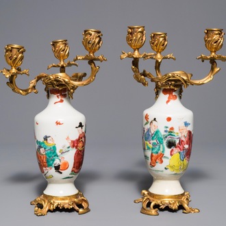 A pair of Chinese gilt bronze candelabra-mounted famille rose vases, Yongzheng