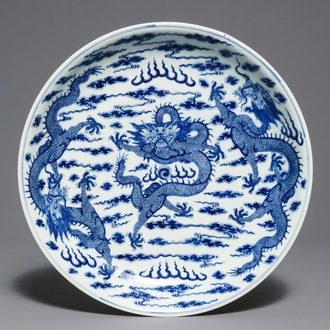 A Chinese blue and white 'dragon' dish, Kangxi mark, 19th C.