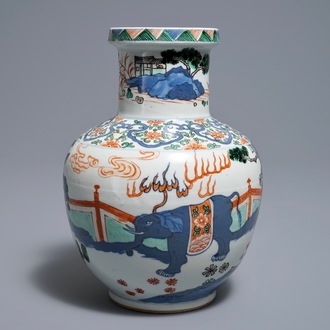A Chinese wucai 'mythical beasts' vase, 19/20th C.