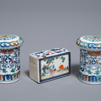 A pair of Chinese doucai scroll ends and a famille rose paper weight, 19/20th C.