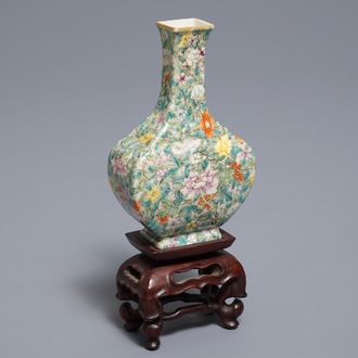 A Chinese eggshell famille rose millefleurs vase on stand, Qianlong mark, 18/19th C.