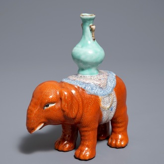A Chinese famille rose elephant joss stick holder, 19th C.