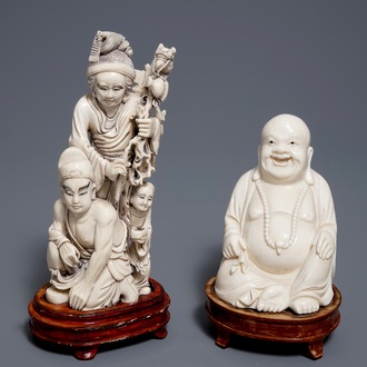 Un groupe en ivoire figurant une famille et une figure du 'Bouddha rieur', Chine, vers 1900