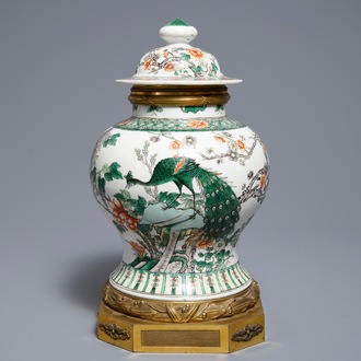 A Chinese famille verte gilt bronze-mounted vase and cover, 19th C.
