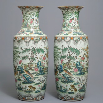 A pair of large Chinese famille rose vases with birds in a garden, 19th C.