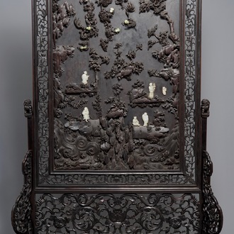 A large Chinese carved zitan wood panel with jade and turquoise, set in a hongmu wood frame and stand, Qianlong
