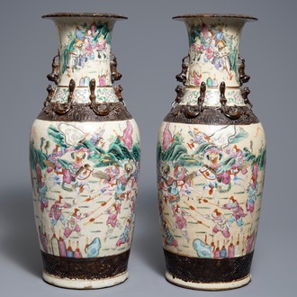 A pair of Chinese Nanking famille rose crackle-glazed vases with warriors, 19th C.