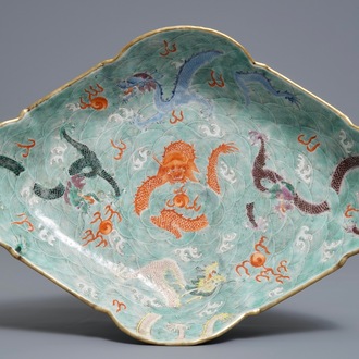 A Chinese imperial quatrefoil 'dragons' dish on foot, Jiaqing mark and of the period