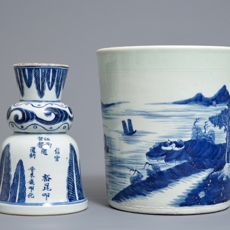 A Chinese blue and white jardinière and an inscribed candlestick, 18/19th C.