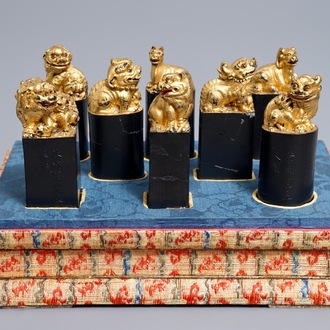 Eight Chinese parcel-gilt ink stones shaped as seals in display box, 18/19th C.