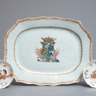 A Chinese famille rose armorial platter and two eggshell saucers after Cornelis Pronk, Yongzheng/Qianlong
