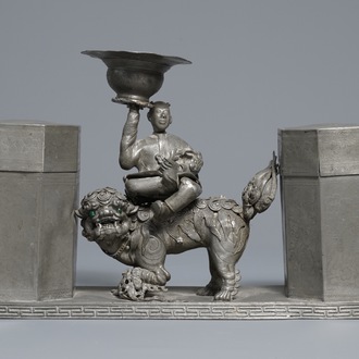 A large Chinese pewter double tea caddy with a central figure, impressed marks, 19th C.