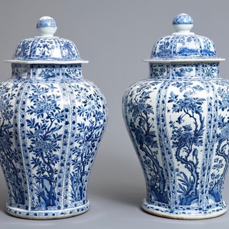 A pair of large Chinese blue and white octagonal baluster vases and covers, Kangxi