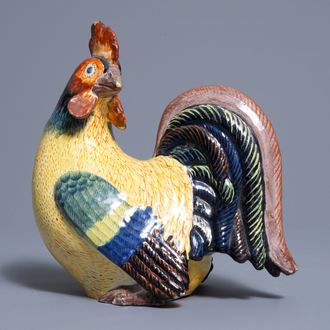 A polychrome Dutch Delft model of a rooster, 19th C.