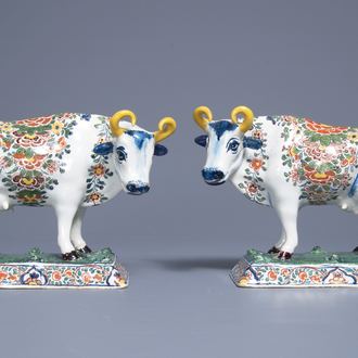 A pair of polychrome Dutch Delft models of cows on bases with frogs, 18th C.