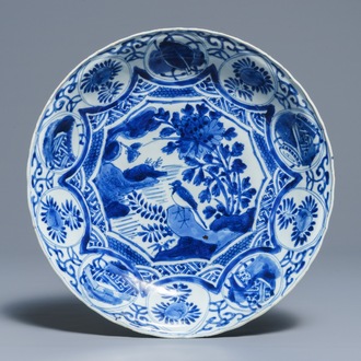 A Chinese blue and white kraak porcelain dish with a bird on a rock, Wanli