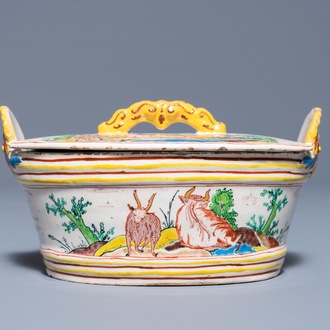 A polychrome Dutch Delft petit feu butter tub and cover with cows and goats, 18th C.