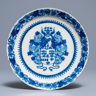 A Dutch Delft blue and white armorial dish, 17/18th C.
