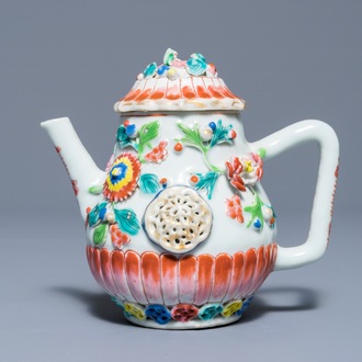 A Chinese famille rose teapot with applied floral design, Yongzheng