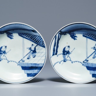 A pair of Japanese Arita blue and white plates with playing boys, Arita, Edo, 18th C.