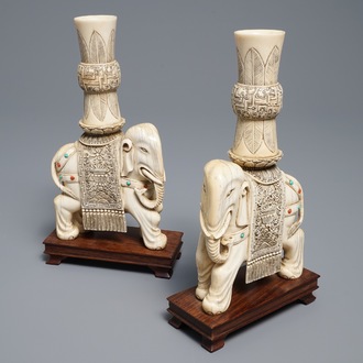 A pair of Chinese coral- and turquoise inlaid ivory elephant candlesticks, 19th C.