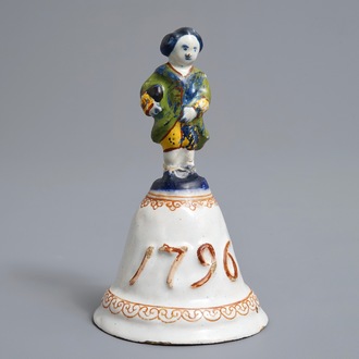 A polychrome Dutch Delft table bell with a nobleman, dated 1796