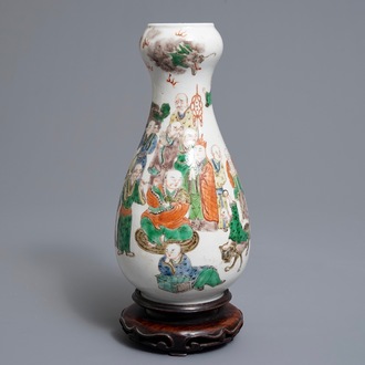 A Chinese famille verte pear-shaped bottle vase with Luohans, 19th C.