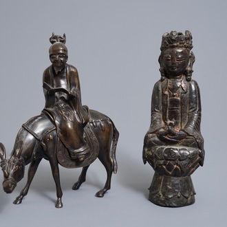 A Chinese bronze Guanyin and a group with a scholar riding a donkey, Ming and later