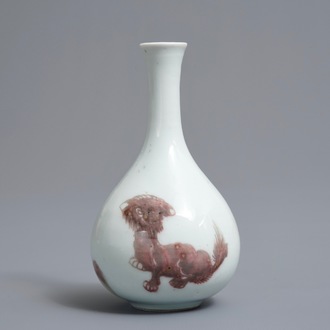 A Chinese copper-red bottle vase with mythical creatures, Kangxi