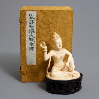 A Chinese carved ivory figure of Guanyin on wooden stand with original box, Republic, early 20th C.