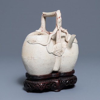 A Chinese biscuit 'conjoined peach' teapot and cover, Kangxi/Yongzheng