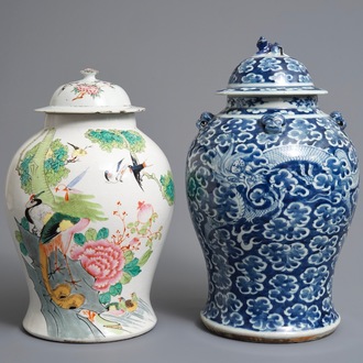 Two Chinese blue and white and famille rose vases and covers, 19/20th C.