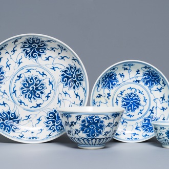 A Chinese blue and white 'lotus' plate, a bowl and a cup and saucer, Guangxu mark, 19/20th C.