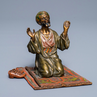 A cold-painted bronze group of a praying muslim, Vienna, signed Bergman, late 19th C.