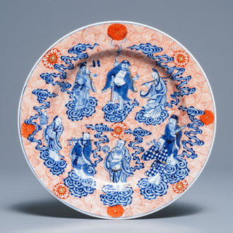 A Chinese blue, white and iron red '8 immortals' dish, Xuande mark, 19th C.