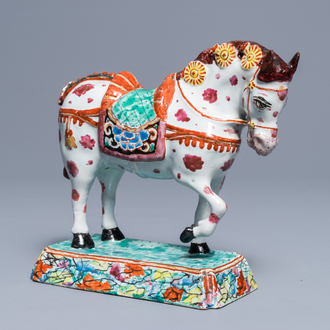 A polychrome Dutch Delft petit feu circus horse on base, 18th C.