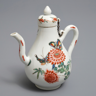 A Chinese famille rose jug and cover with birds and butterflies, Yongzheng mark and of the period