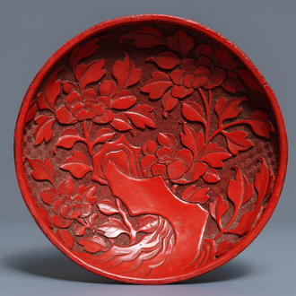 A Chinese cinnabar lacquer dish with floral design, 18/19th C.