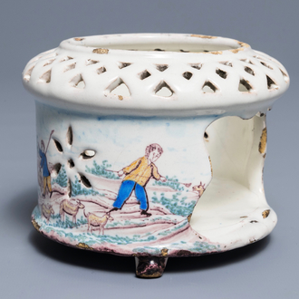 A polychrome Dutch Delft stove with a pastoral scene, late 18th C.