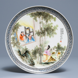 A Chinese fencai plate with figures in a garden, Republic, 20th C.