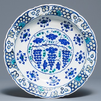 An Iznik 'grapevine' dish in blue and green, Turkey, 3rd quarter 16th C.