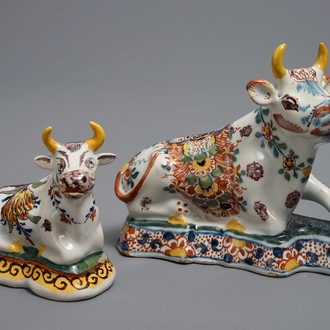 Two polychrome Dutch Delft models of recumbent cows, 18th C.