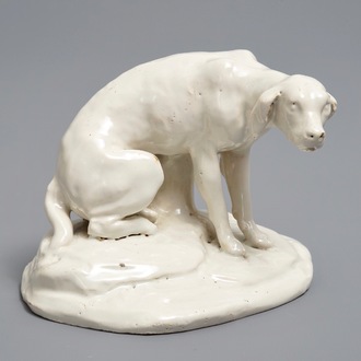 A white Dutch Delft model of a dog, 18th C.