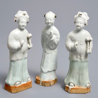 Three Chinese white- and celadon glazed biscuit figures, Qianlong