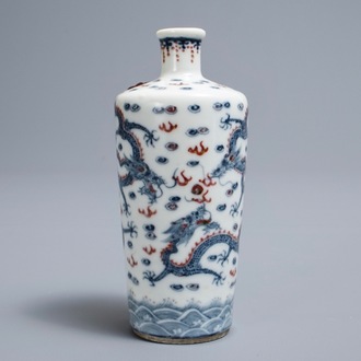 A Chinese blue, white and underglaze red 'dragon' vase, Kangxi mark, 19/20th C.