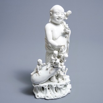 A Chinese blanc de Chine 'Buddha and playing boys' group, Republic, 20th C.