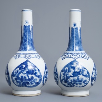 A pair of Chinese blue and white bottle vases, Kangxi mark, 19/20th C.