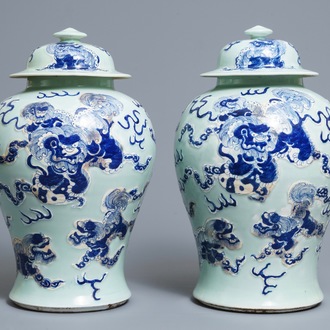 A pair of Chinese blue, white and underglaze red celadon ground vases and covers, 19/20th C.